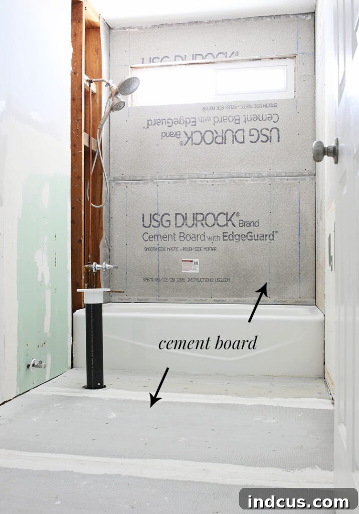 Close-up of taped and mudded cement board seams on bathroom floor