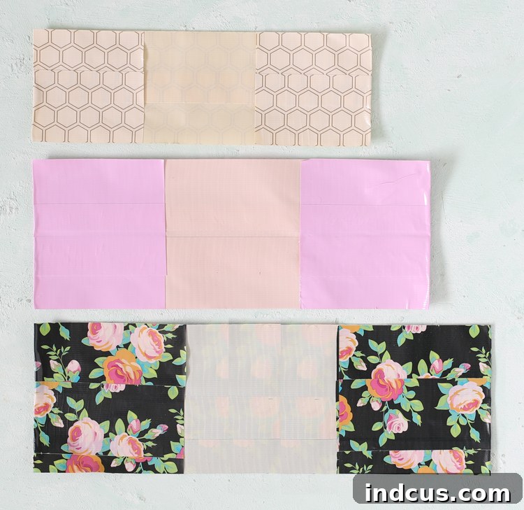 Finished Duck Tape squares with folded edges, ready for assembly into box layers.