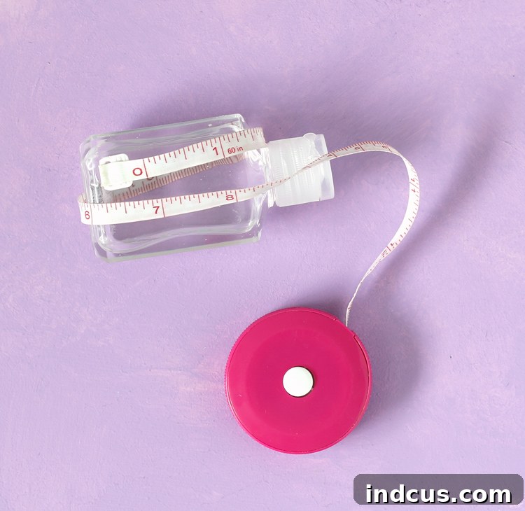 Clever Duck Tape Sanitizer Carriers 5 Measuring a hand sanitizer bottle with a measuring tape.