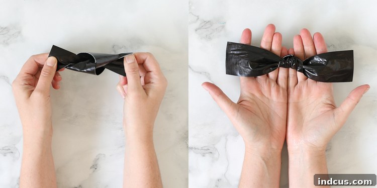 Tying a knot in the Duck Tape strip to form the bat's body