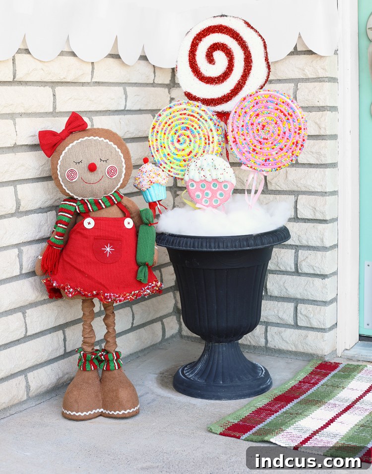 Gingerbread themed Christmas porch decor featuring gingerbread figures and candy elements