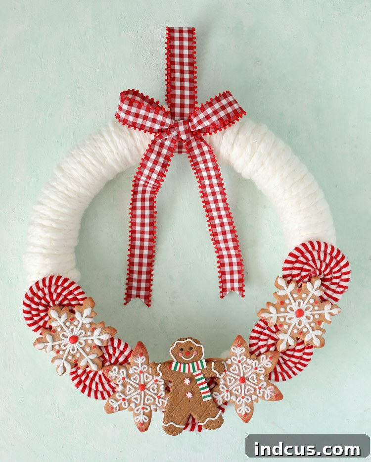 Finished DIY Christmas treats wreath with gingerbread men and peppermint candies