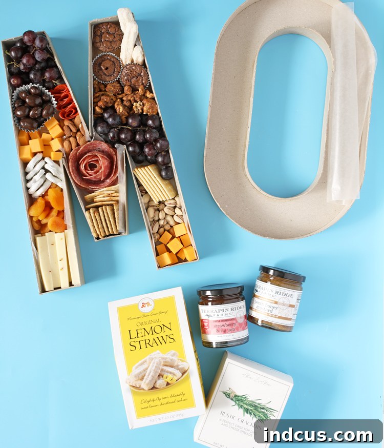 DIY charcuterie letters filled with delicious snacks