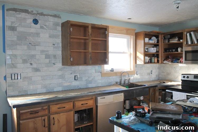 Applying thinset to individual marble tiles
