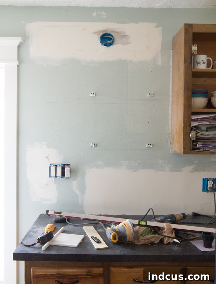Installing floating shelf brackets before tiling a kitchen backsplash