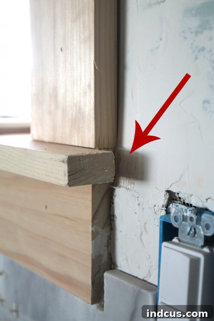 Marble tile seamlessly tucked behind window trim