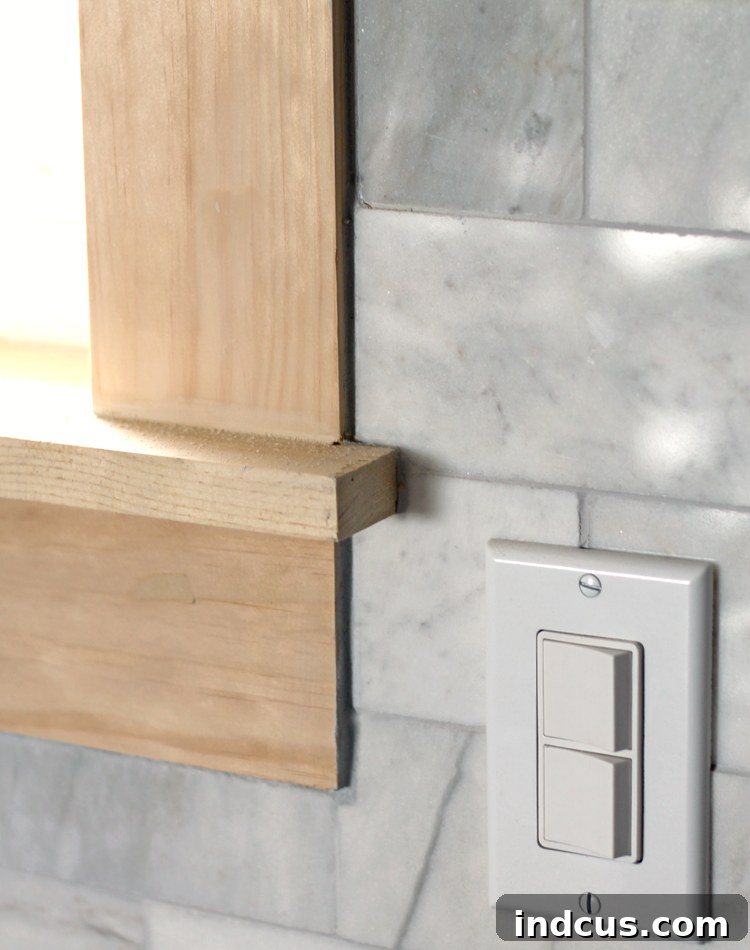 Professional finish of subway tile around craftsman window trim