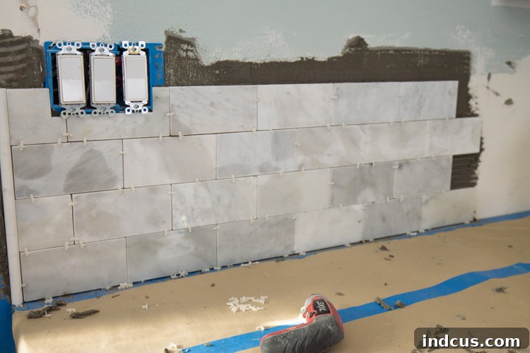 Marble tile discoloration when wet during backsplash installation
