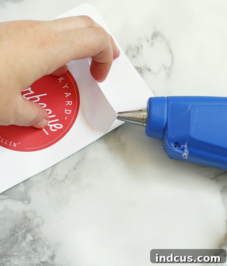 Step-by-step guide on how to apply hot glue to make a utensil pocket