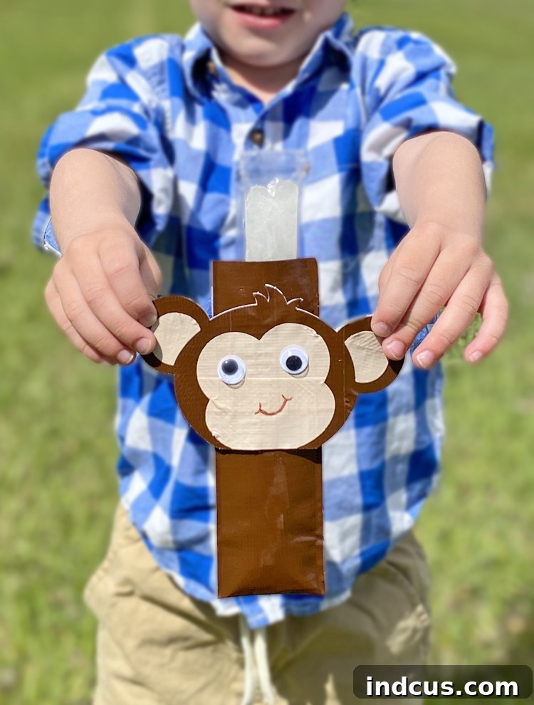 Finished animal-themed ice pop cozies made from Duck Tape, holding popsicles