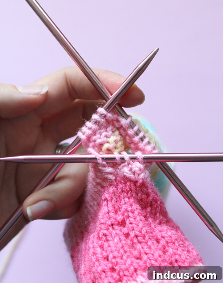 Thumb Gusset Stitch Pick Up Knitting Gloves Techniques: Picking up stitches for the thumb gusset, ensuring a seamless finish.