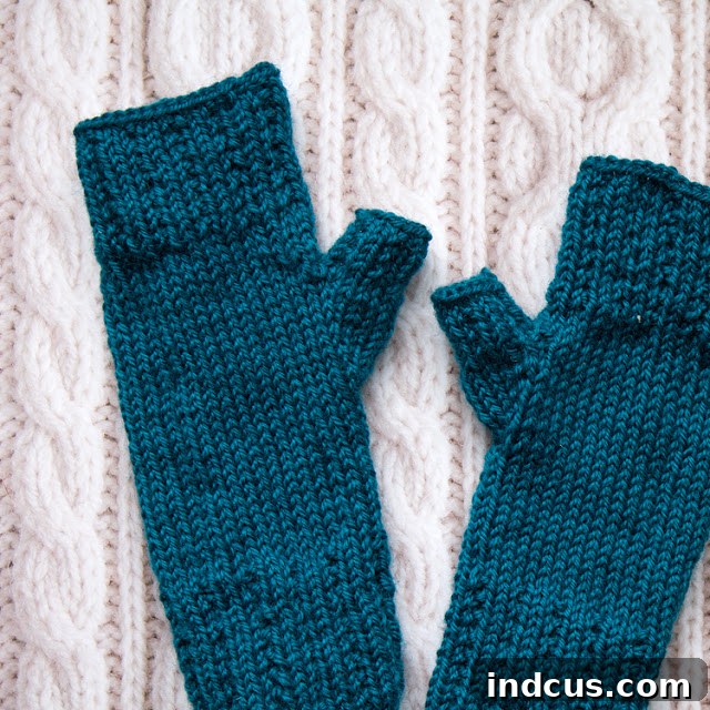 Paton's Wool Worsted Yarn Mitts Knit gloves pattern in a beautiful teal color for a thoughtful gift.