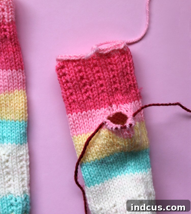 Thumb Gusset and Main Body Finished Using waste yarn in knitting patterns for the thumb gusset, showing the main body complete and ready for the thumb.