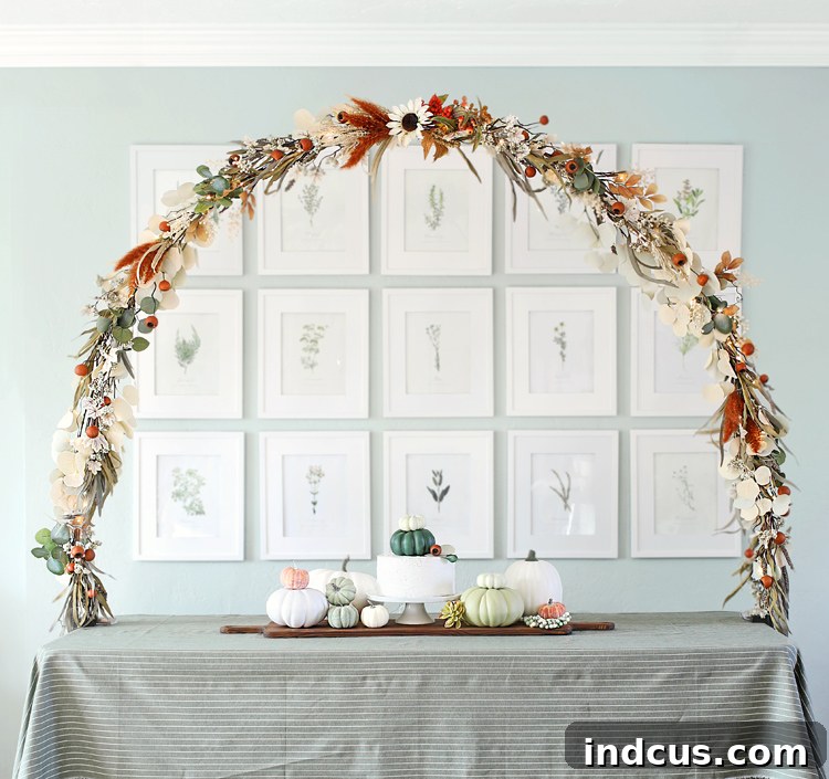 Stunning DIY tabletop arch adorned with neutral fall florals for party decoration