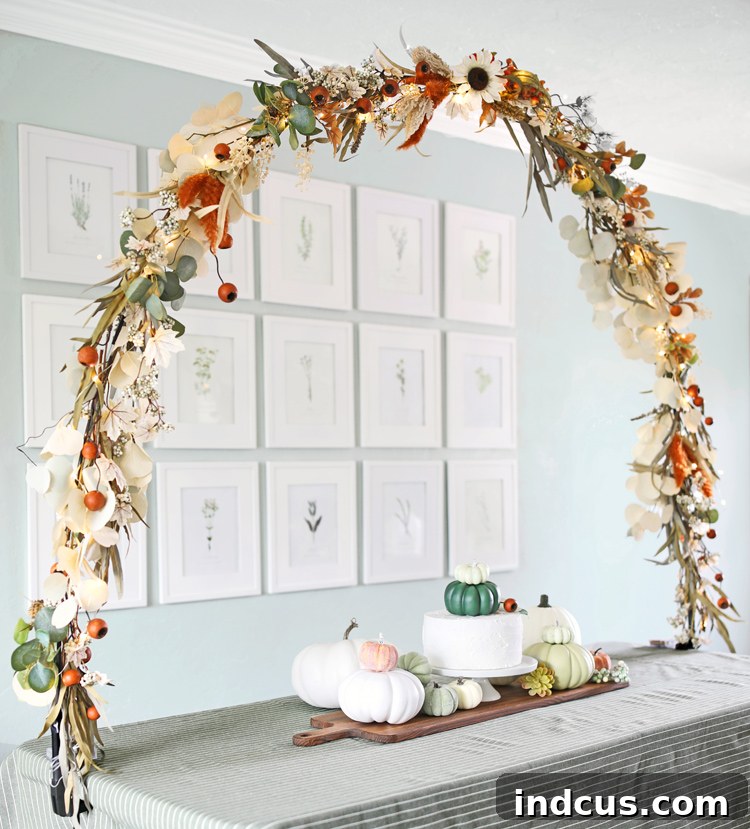 Close-up of the elegant DIY floral table arch detail with autumn decorations