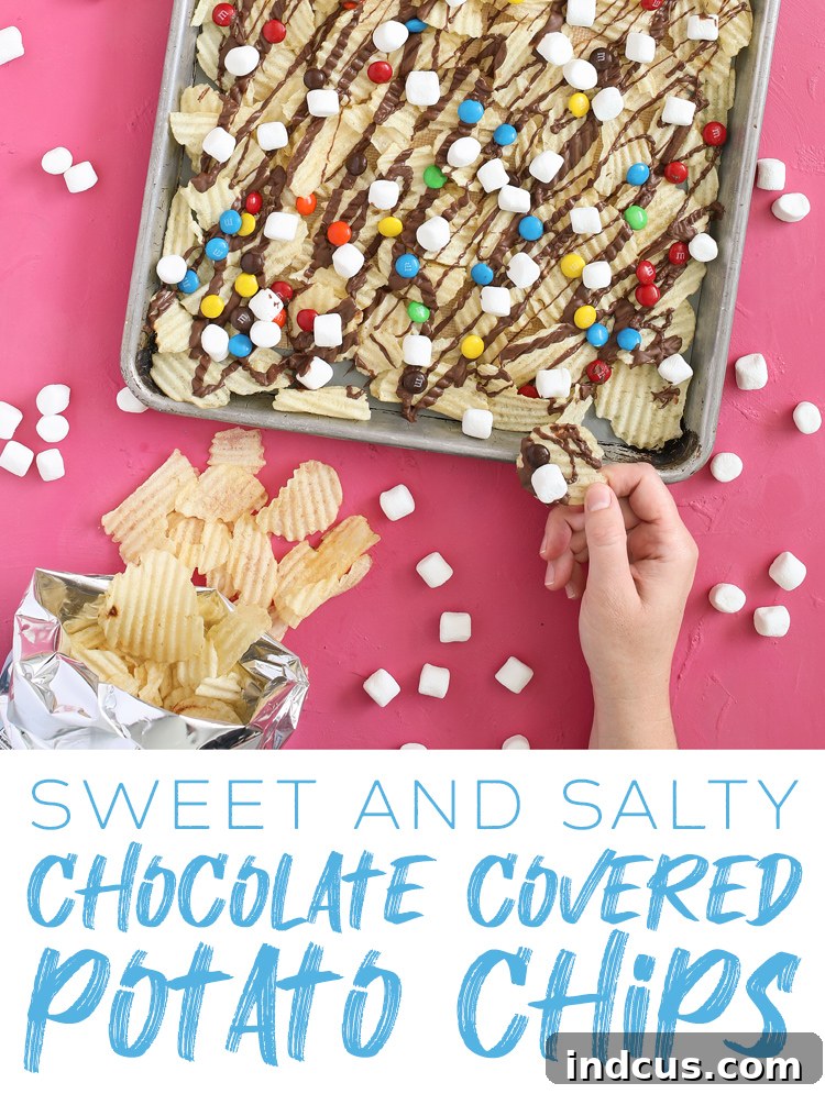 Large platter showcasing sweet and salty chocolate covered potato chips with M&Ms and marshmallows, perfect for sharing