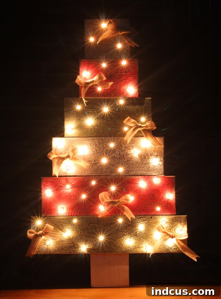 Pallet wood Christmas tree decoration illuminated at night