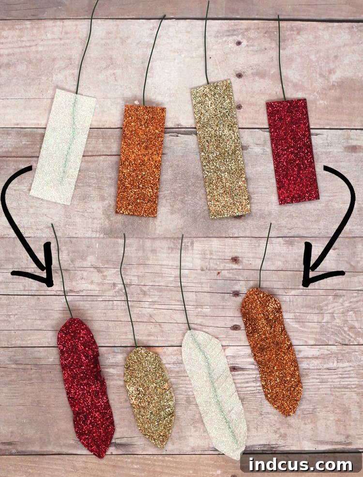 Close-up of shaped glitter washi tape feathers, ready for assembly on the wood slice turkey
