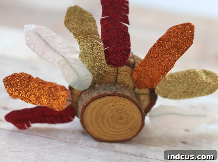The final step: adding a second wood slice to the back of the turkey for stability and a finished look