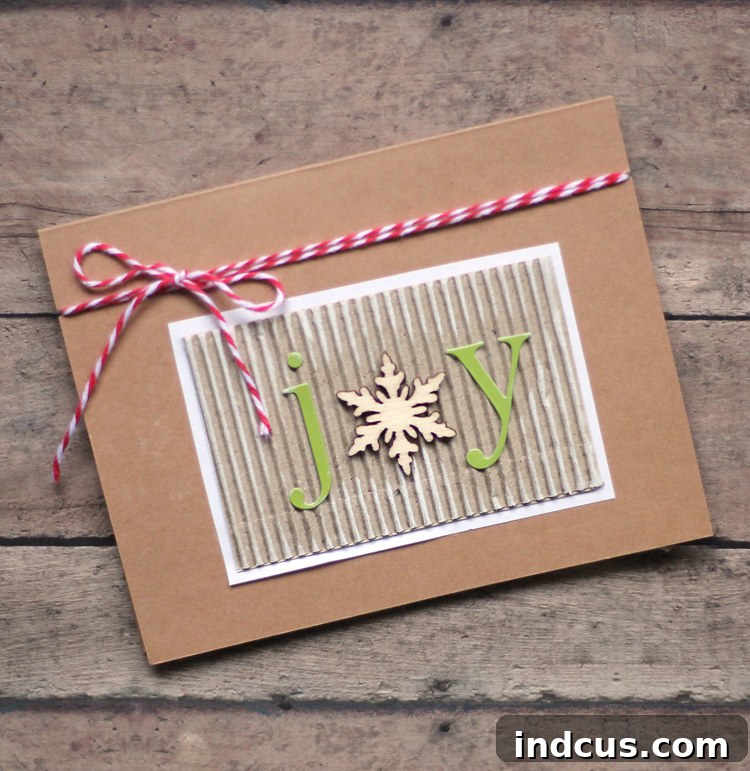 Easy handmade Christmas card featuring a prominent wooden snowflake and baker's twine