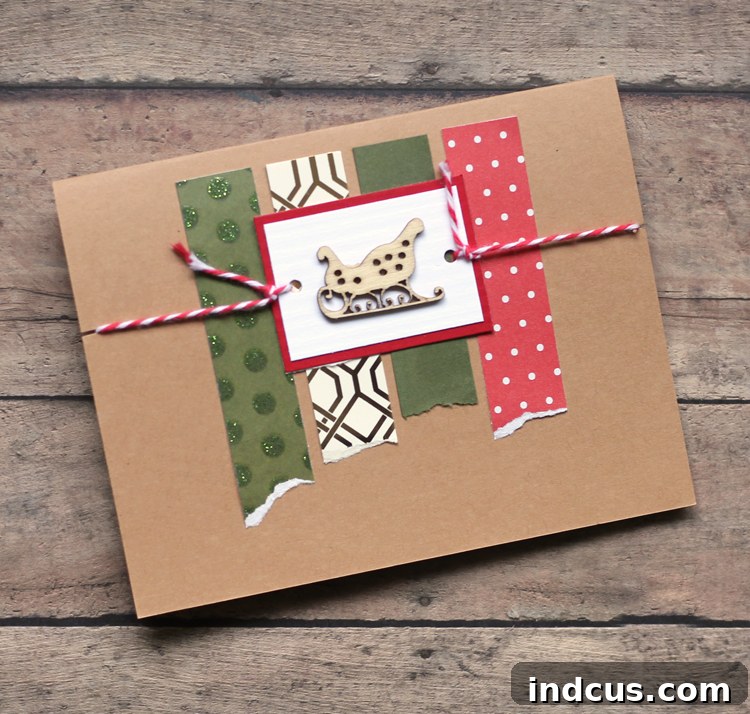 Simple handmade Christmas card with a single wooden ornament and twine