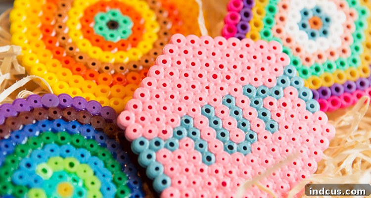 A set of colorful Hama bead coasters, creatively designed by children for Mother's Day.