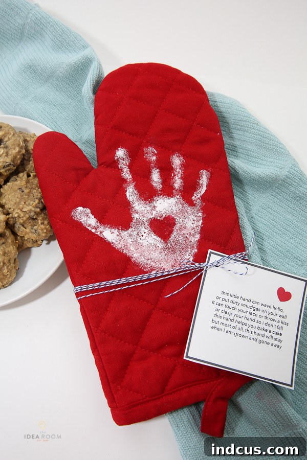 A child's handprint oven mitt, personalized with a charming poem, for a thoughtful Mother's Day gift.