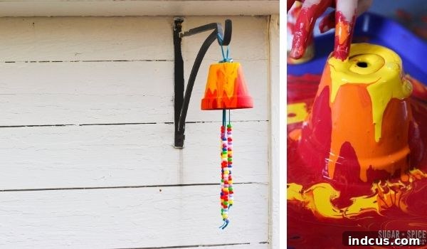 Colorful paint pour wind chimes, a creative kids' craft for the garden that produces beautiful melodies.