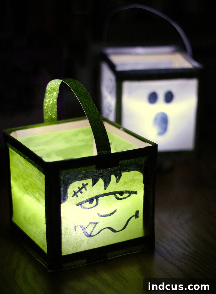 Close-up of a glowing Frankenstein monster luminary, showcasing its detailed face and glitter accents.