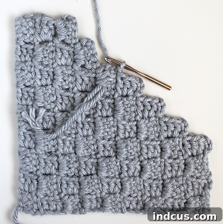 Crochet Pillow Tutorial Step 13: Continue decreasing across the row