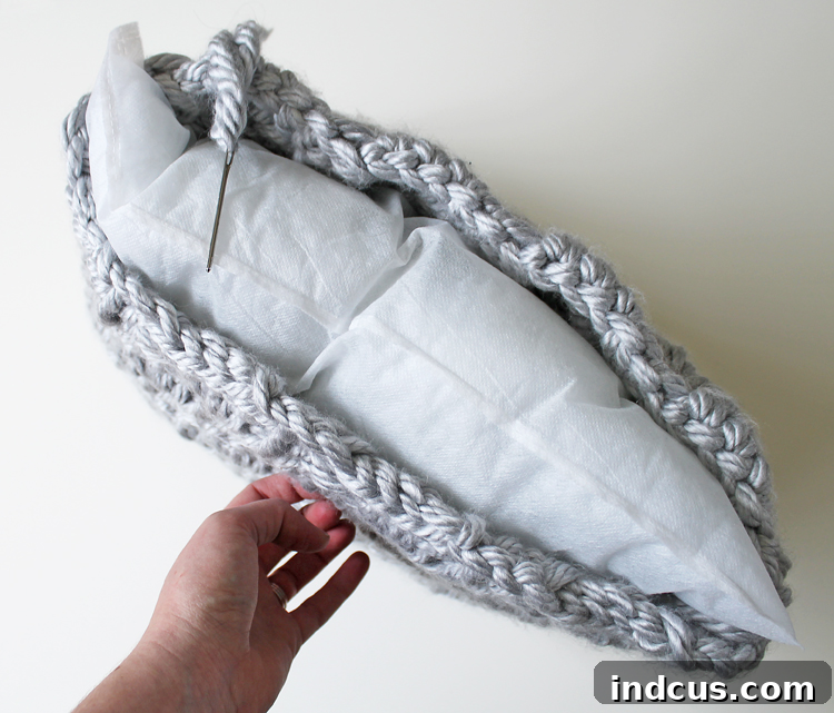 Making a crochet pillow: Inserting the pillow form into the cover