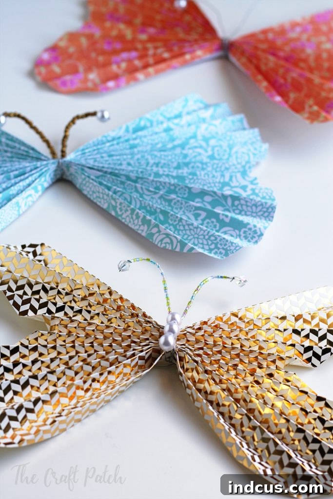 Assembling DIY paper butterflies with wire and beads