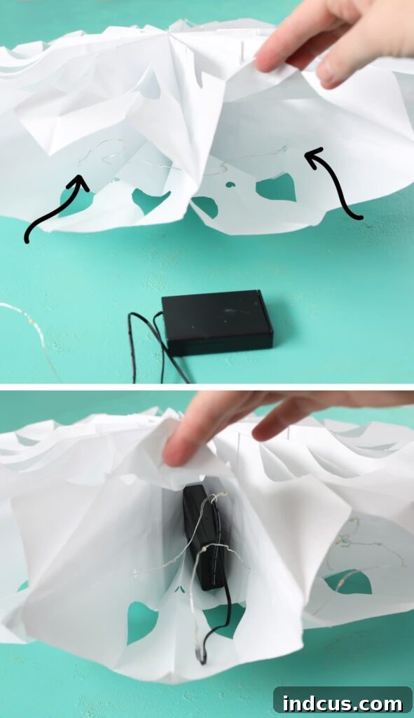 Glimmering Paper Star Lanterns 10 Carefully threading fairy lights through the pre-punched holes of a paper bag star for even illumination