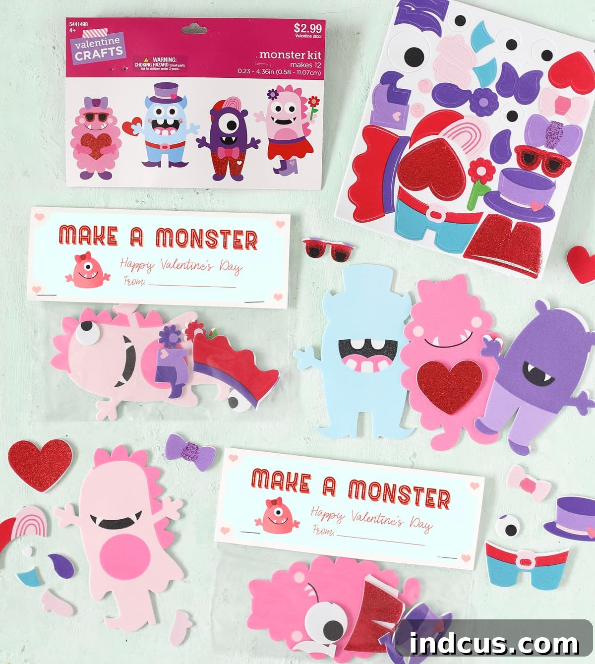 Printable monster Valentine's Day card with a colorful monster craft kit attached in a plastic bag, secured by a stapled folded card.