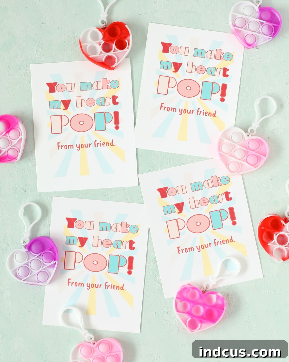Printable pop it Valentine's Day card with a heart-shaped fidget toy attached, featuring the phrase 'You Make My Heart POP!'