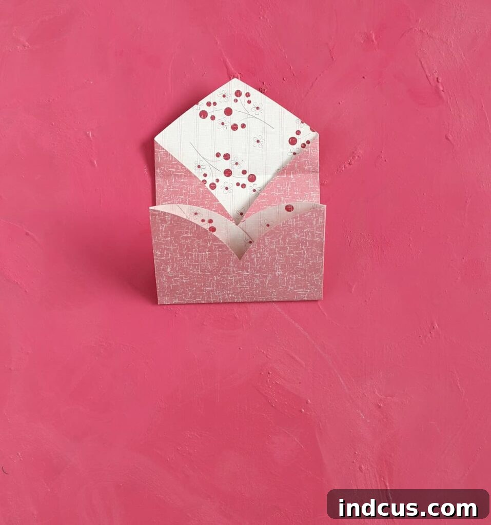 Craft Your Own Heart Envelope 5 Take the curved bottom part of the now-folded heart and fold it upwards, creating the base of your envelope pocket.