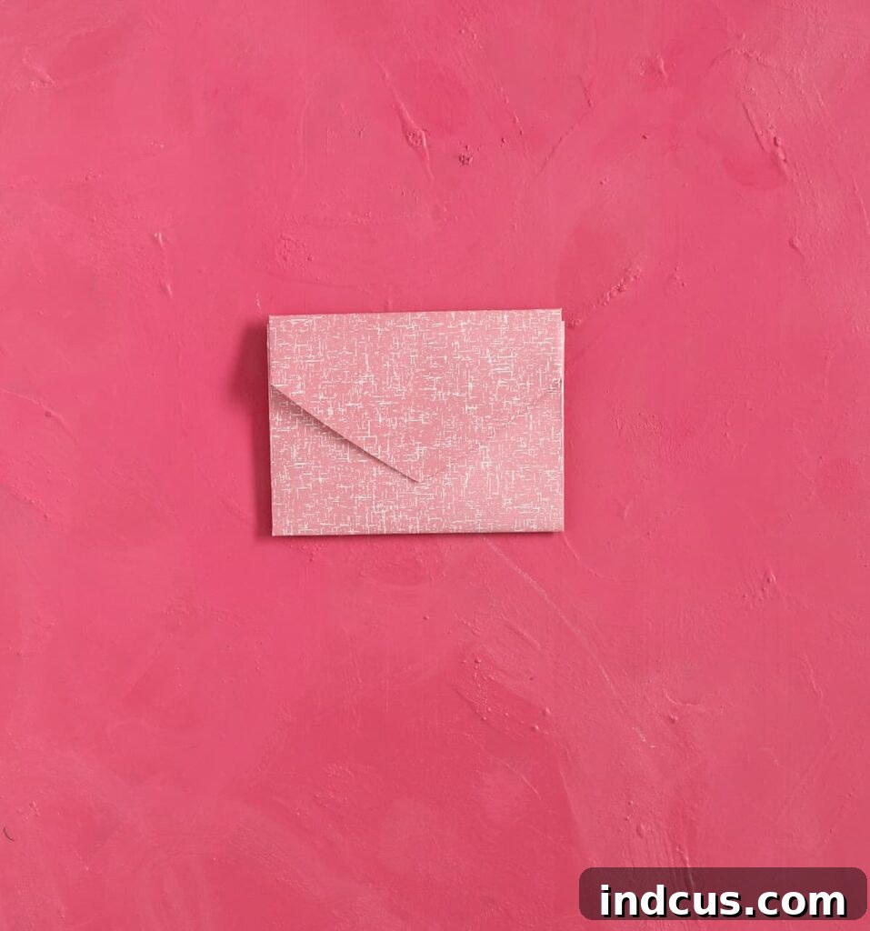Craft Your Own Heart Envelope 6 Complete your DIY paper heart envelope by folding the top pointed tip downwards to create the sealing flap.