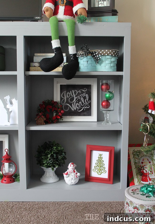 Our Christmas Wonderland 18 Curated shelf styling featuring various Christmas items, beautifully contrasted against a gray background.