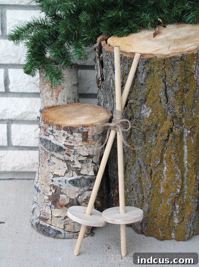 Our Christmas Wonderland 3 Handmade mini wooden ski poles craft, adding a unique rustic touch to outdoor Christmas decorations.