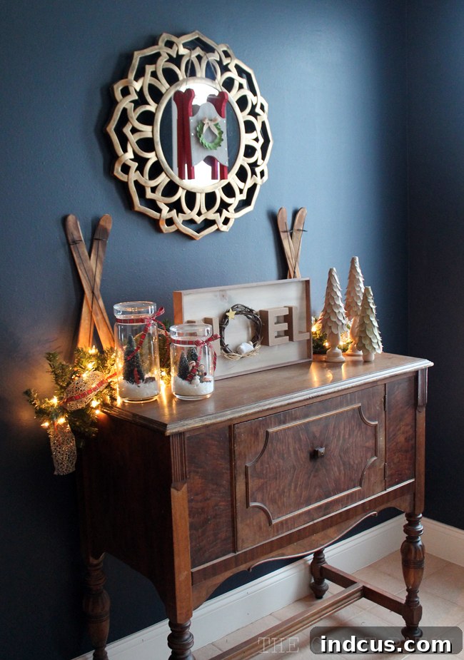 Our Christmas Wonderland 5 Elegant entryway table adorned with classic Christmas decorations, creating a warm and welcoming first impression.