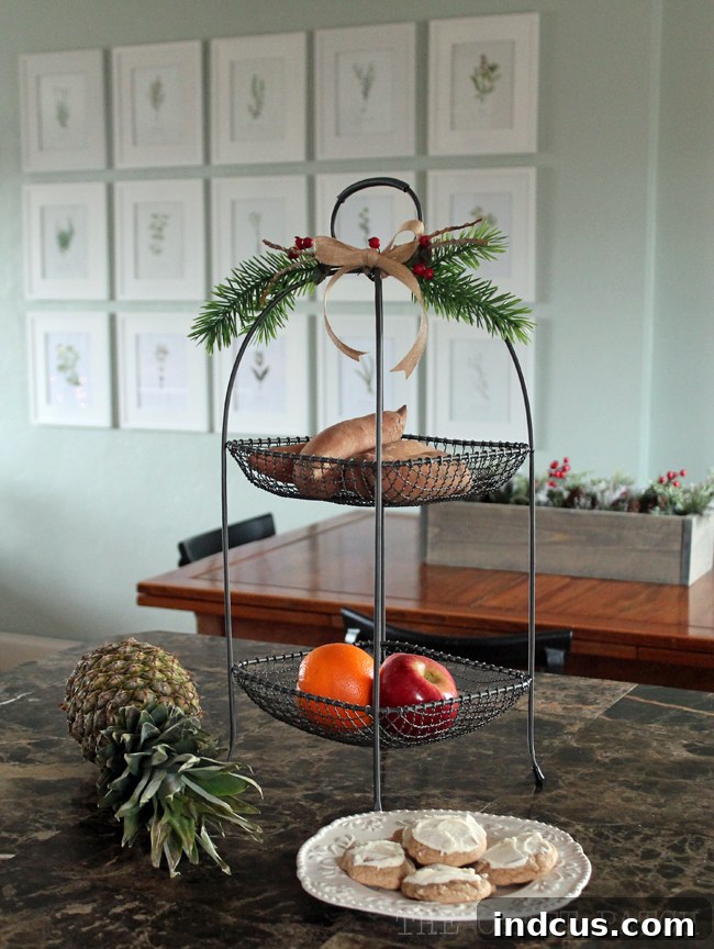 Our Christmas Wonderland 10 Simple yet effective kitchen Christmas decor: pine sprigs adorning a fruit basket, adding natural holiday charm.