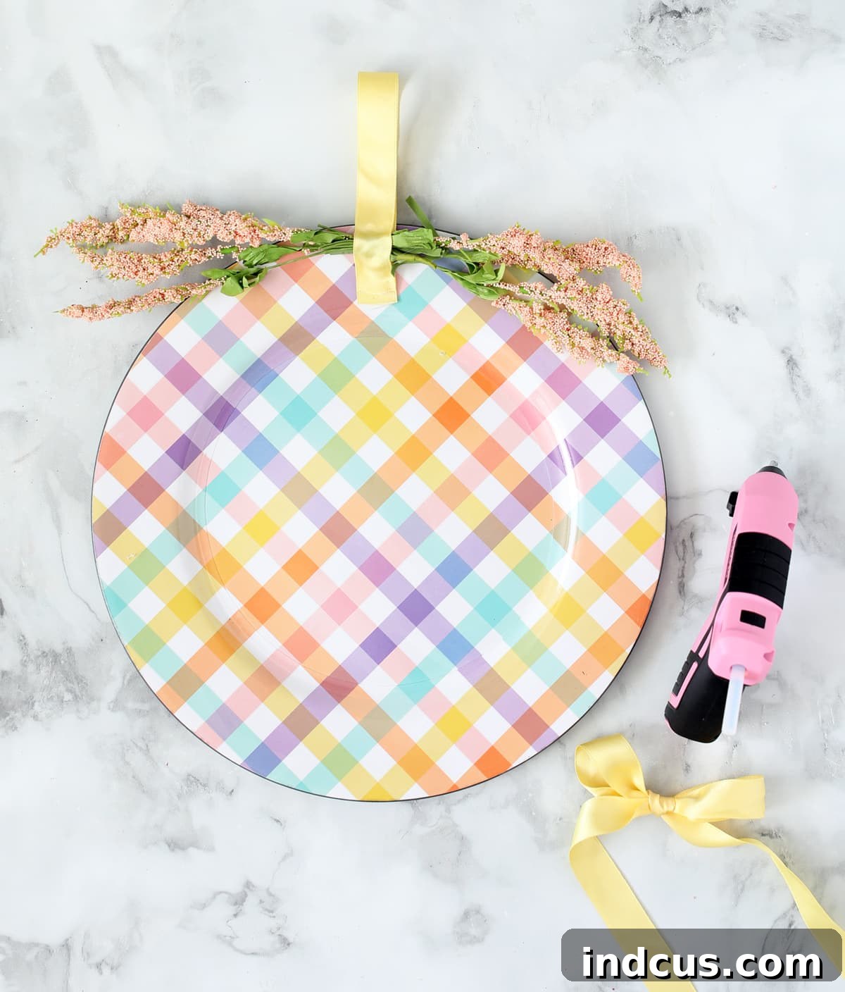 Assembling the charger plate door hanger with florals and ribbon