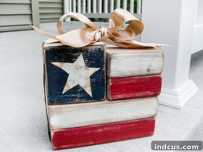 Small wood flag blocks, painted red, white, and blue, arranged as decor