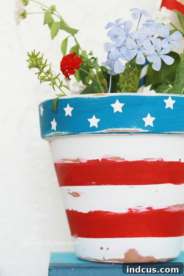 Patriotic painted flower pot with stars and stripes design