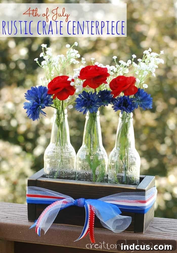 Rustic crate centerpiece with bottle vases and patriotic flowers