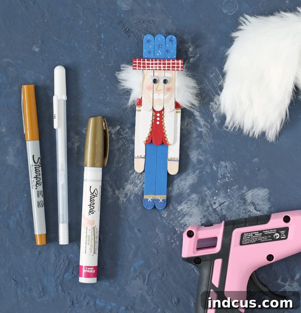 Close-up of a finished popsicle stick Uncle Sam craft, showing detailed paint pen work and faux fur