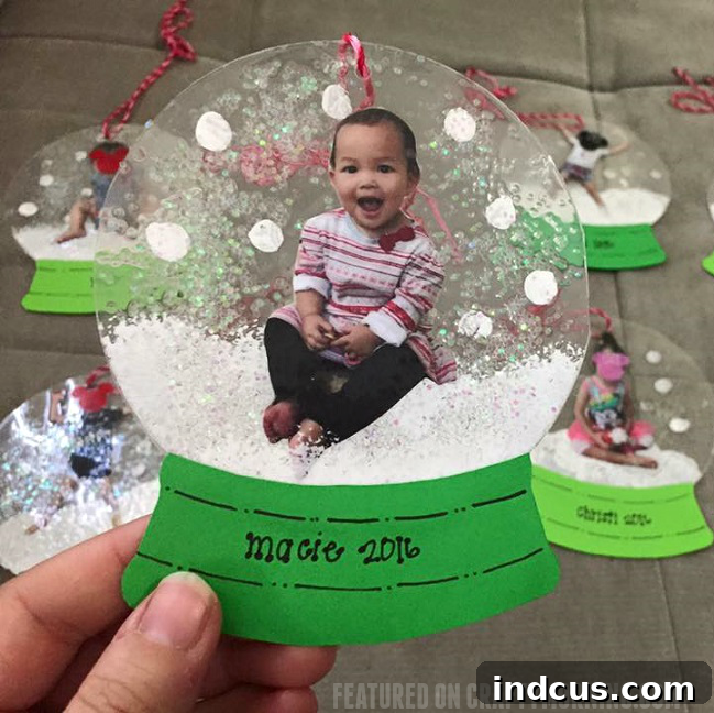 Laminated photo snowglobe ornaments as keepsakes