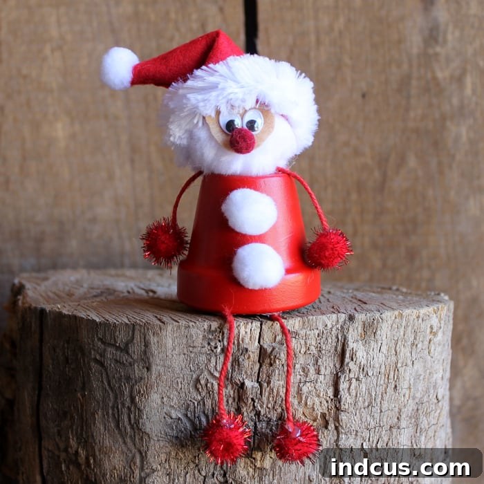 Terra cotta Santa craft with dangly arms and legs