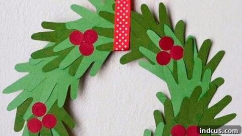 Kids hand print Christmas wreath made from green paper