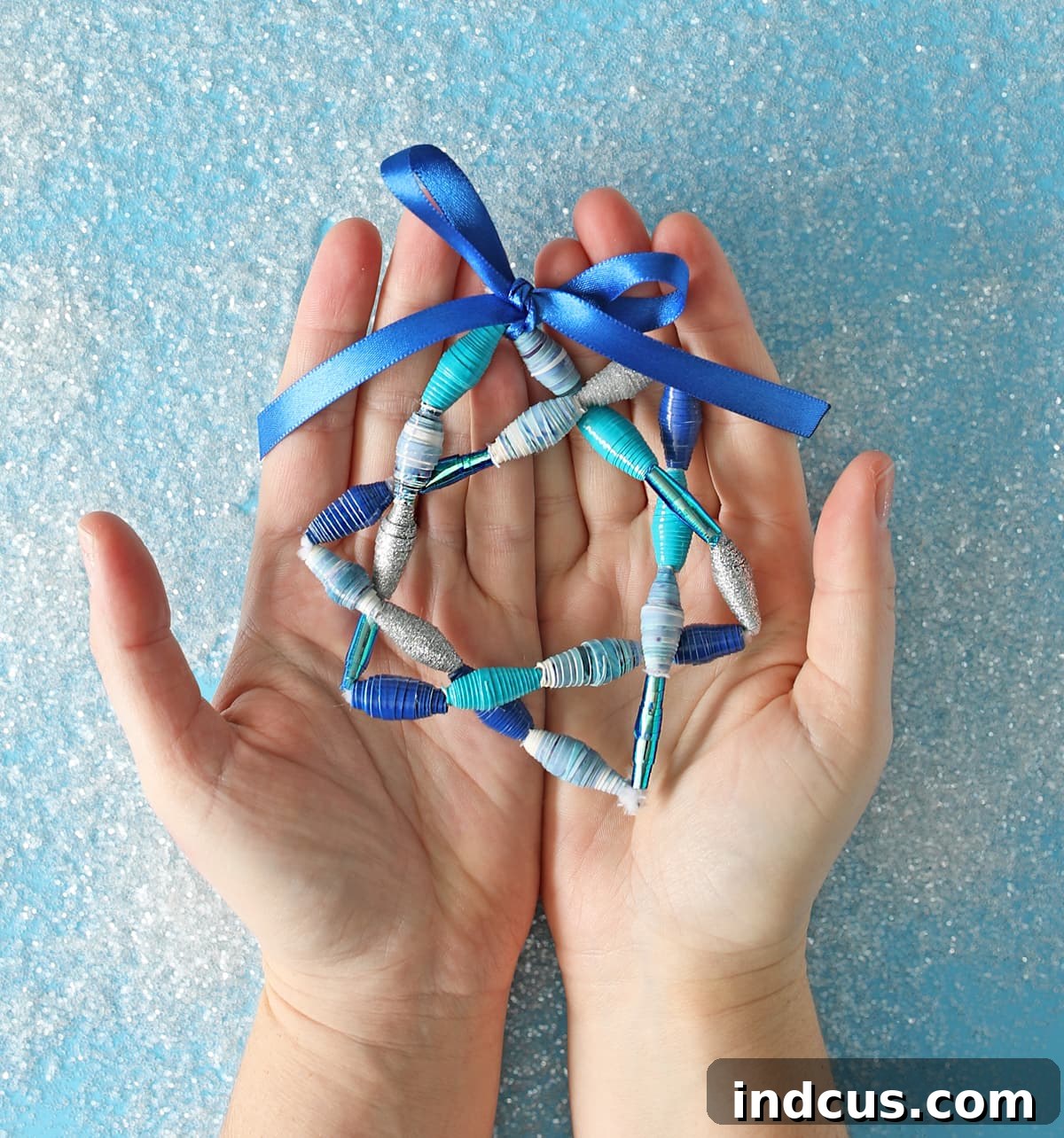 Close-up view of the finished Star of David craft, highlighting the texture and colors of the Duck Tape beads